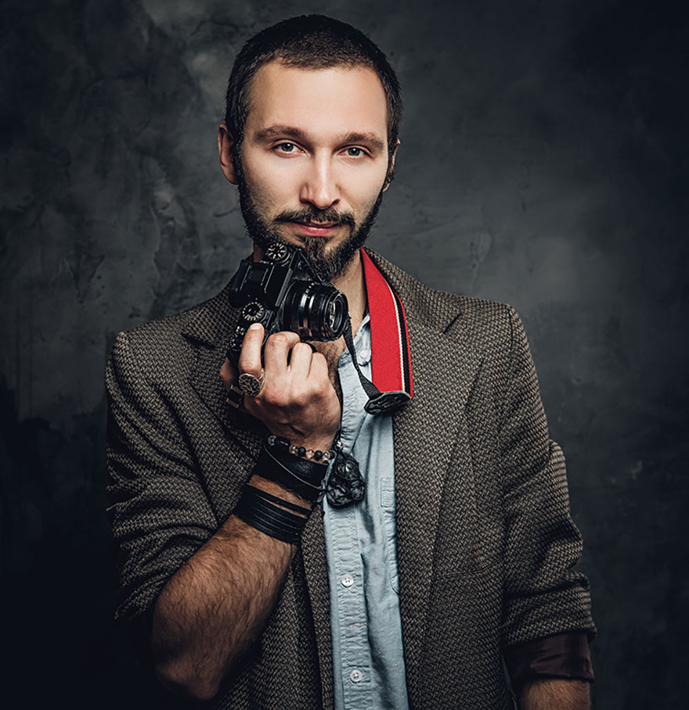 man-is-posing-for-photographer-with-photo-camera-resize.jpg